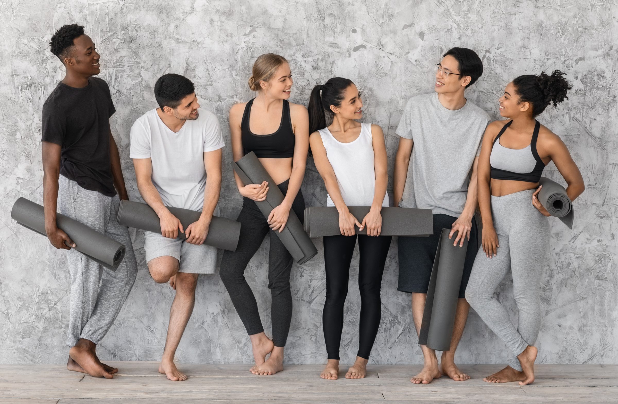 A group holding rolled mats